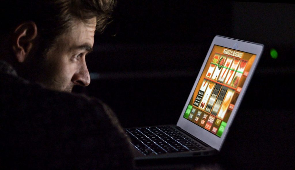 close-up-man-playing-game-laptop